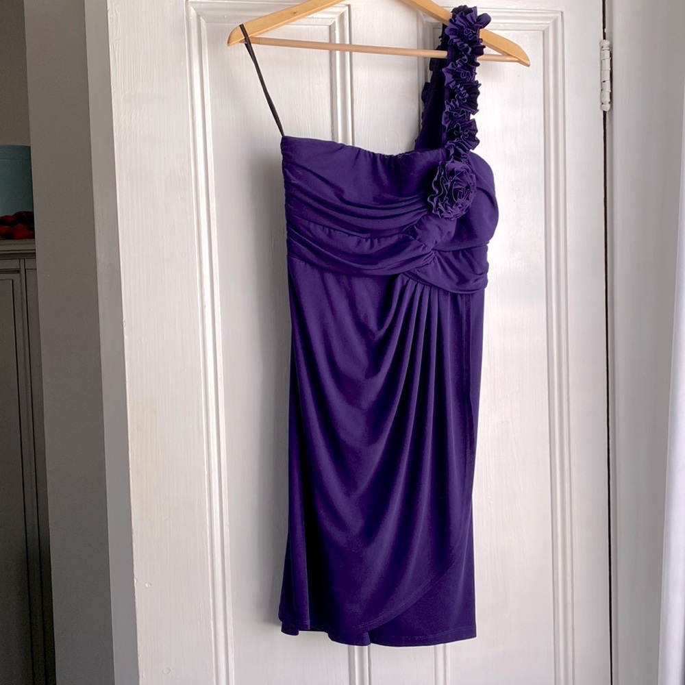 Purple one shoulder formal dress.